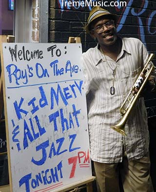 image of Kid Merv standing front of sign